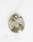 Moss agate pendant set in gold prongs 