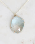 Blue topaz necklace pendant with gold prongs