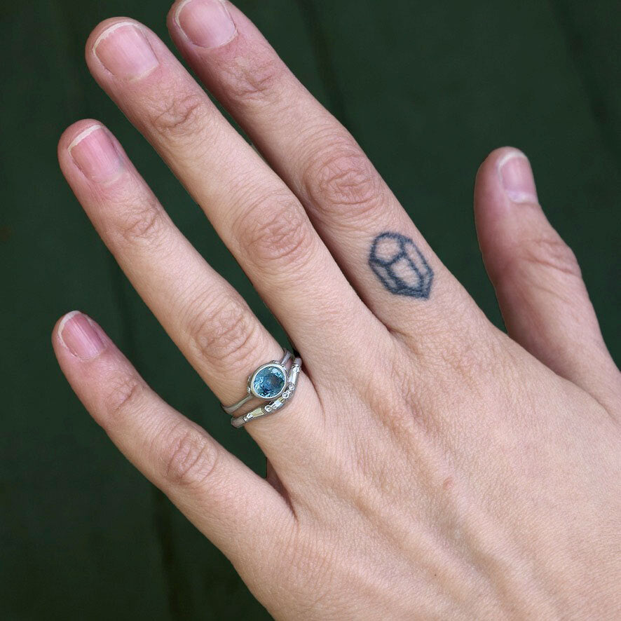 curved band with sapphire ring 