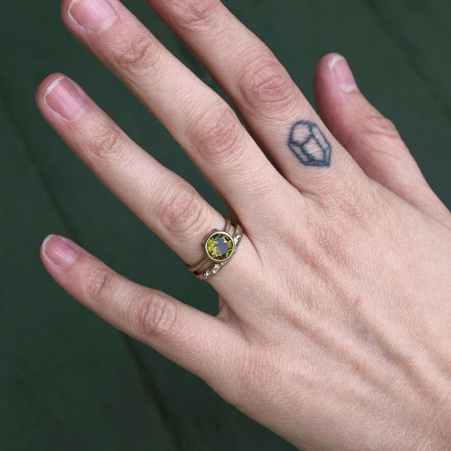 gold ring stacked with gemstone 