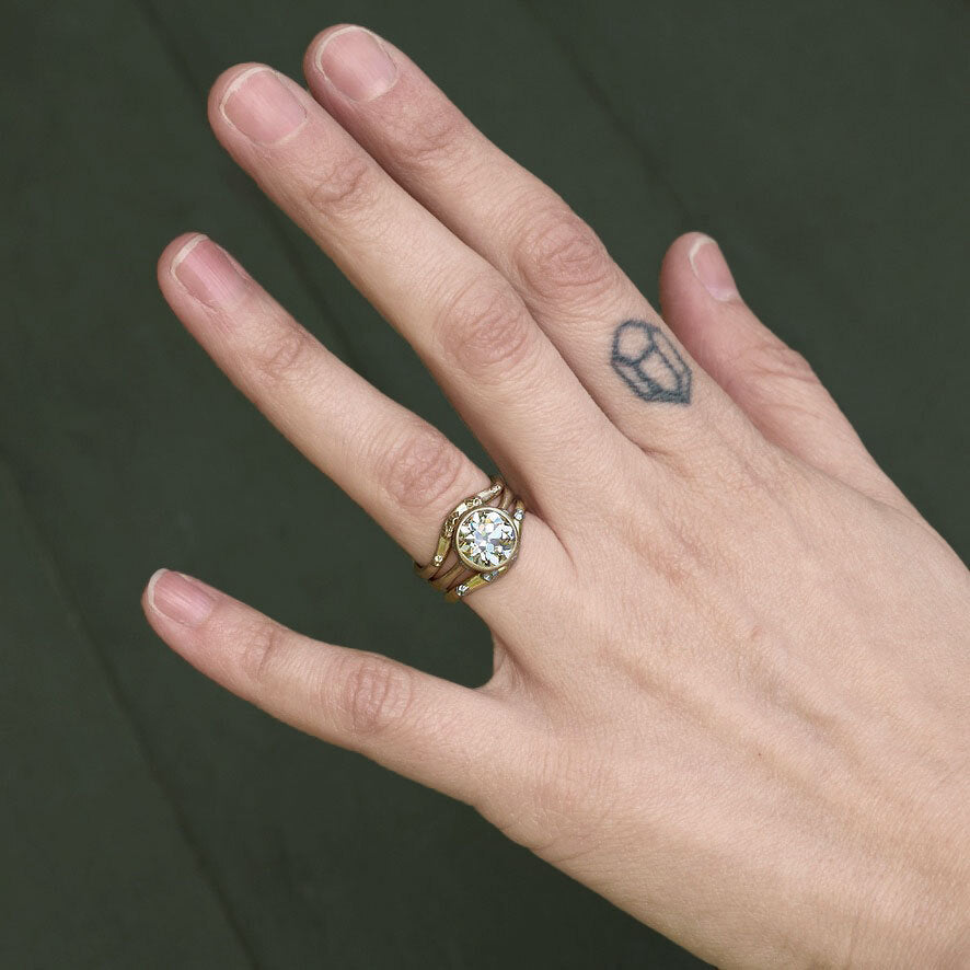 Diamond ring stacked with curved bands 