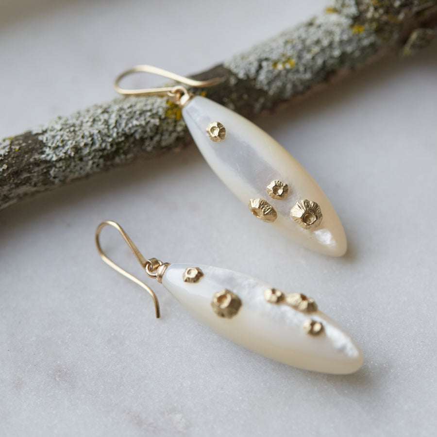 Large mother of pearl earrings with gold barnacles by Hannah Blount