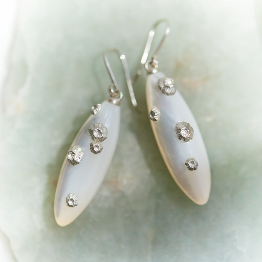 Large mother of pearl earrings with silver barnacles by Hannah Blount