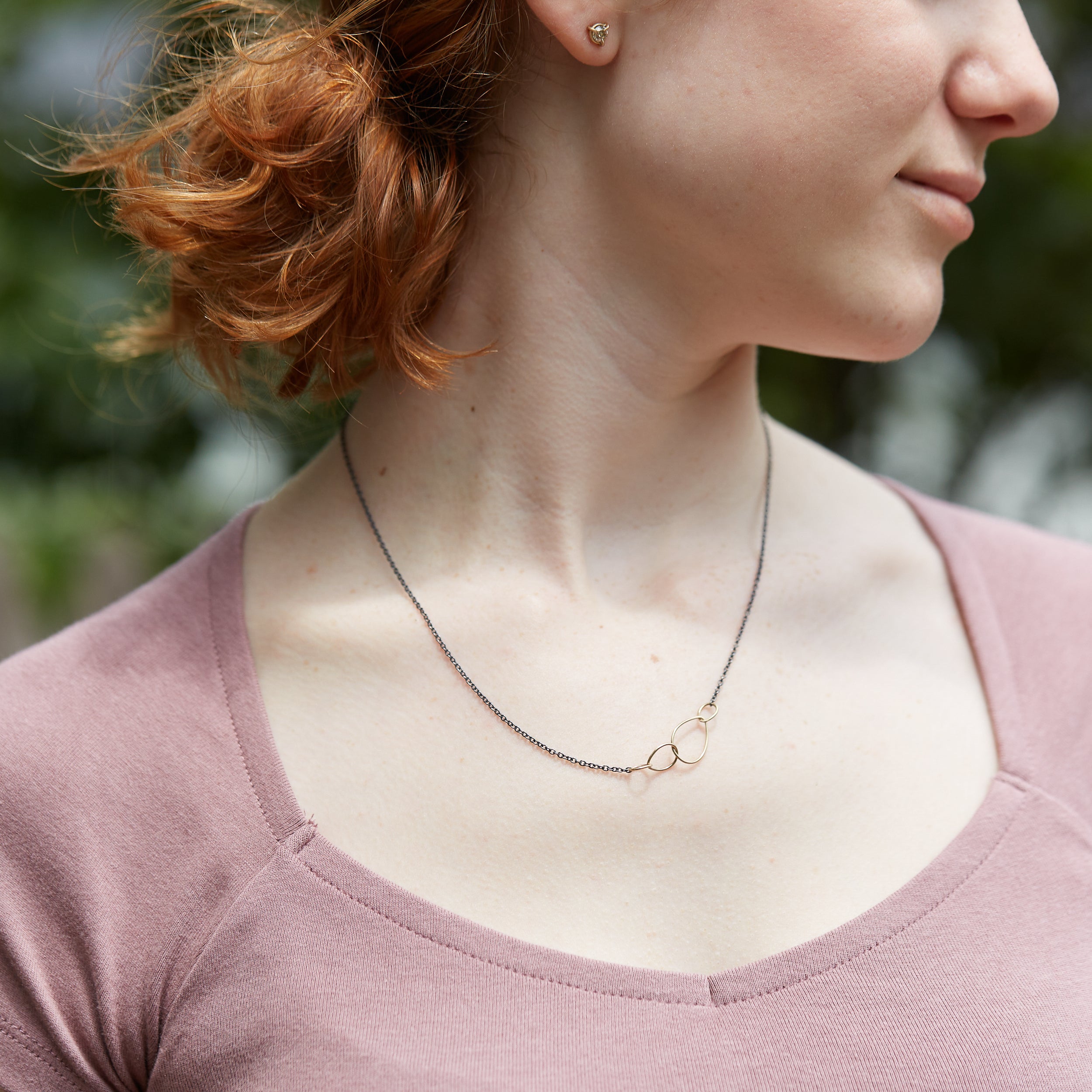 Oxidized silver + 14k gold egg necklace on person- Hannah Blount